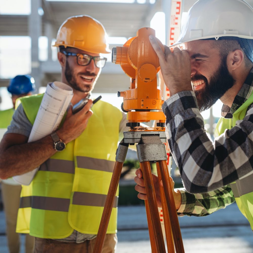 engineer-surveyor-working-with-theodolite-at-construction-site.jpg